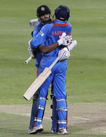India's Harbhajan Singh and Ashish Nehra celebrate after winning the third ODI against South Africa