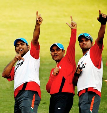 Suresh Raina (right), Virender Sehwag (centre) and Mahendra Singh Dhoni during a practice session
