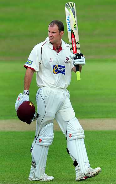 Andrew Strauss reacts after completing his century against Indians in Taunton