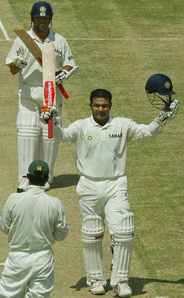Virender Sehwag celebrates after scoring a double century against Pakistan