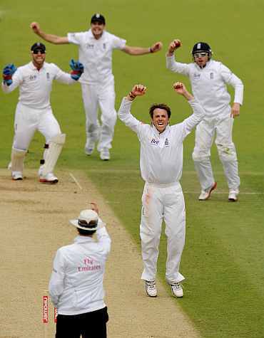 Graeme Swann celebrates after picking up a wicket