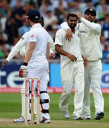 Praveen Kumar celebrates after picking the wicket of Eoin Morgan