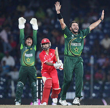 Shahid Afridi (right) of Pakistan appeals successfully for wicket of Ashish Bagai of Canada