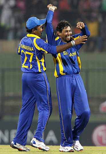 Tillakaratne Dilshan celebrates after picking up a wicket against Zimbabwe