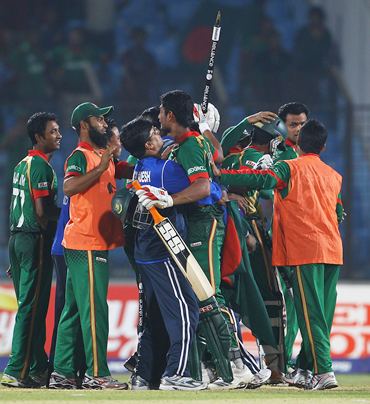 Mahmudullah is congratulated by team mates after hitting the winning runs