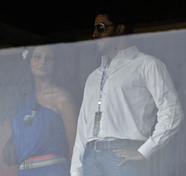 Bollywood stars Bipasha Basu (left) and Abhishek Bacchan watch the match between India and South Africa on Saturday