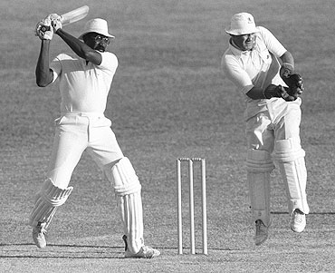Clive Lloyd of the West Indies hits four during his innings of 100 in the third Test against England at Barbados in 1981