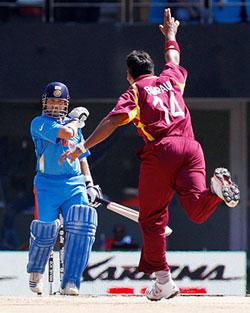 Ravi Rampaul of West Indies celebrates after dismissing Sachin Tendulkar