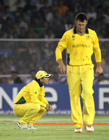 Australia's Ricky Ponting and David Hussey react after losing his quarter-final match against India