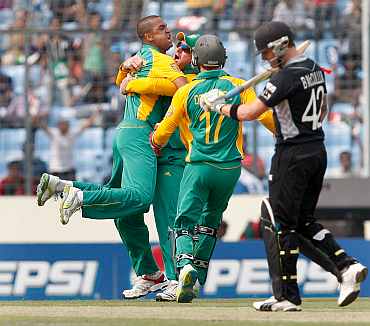 South Africa's Robin Peterson celebrates after picking the wicket of Brendon McCullum