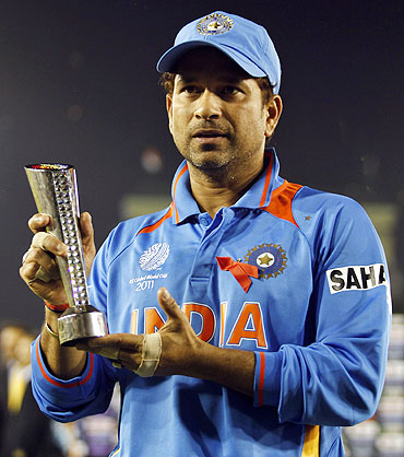 India's Sachin Tendulkar poses with his man of the match trophy
