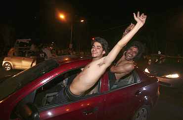 Fans celebrate on roads after India won their semi-final match against Pakistan