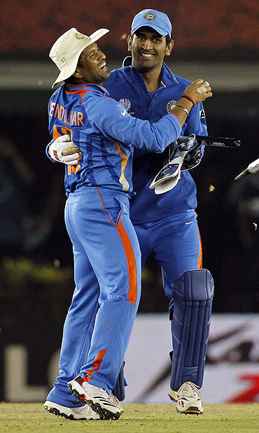 India's Sachin Tendulkar (left) hugs captain and wicketkeeper Mahendra Singh Dhoni after India beat Pakistan