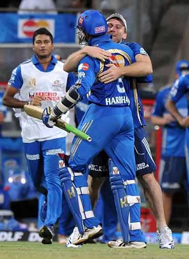 Harbhajan Singh celebrates with teammate after winning the Eliminator match