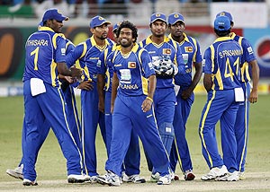 Sri Lanka's Lasith Malinga (centre) and his teammates celebrate