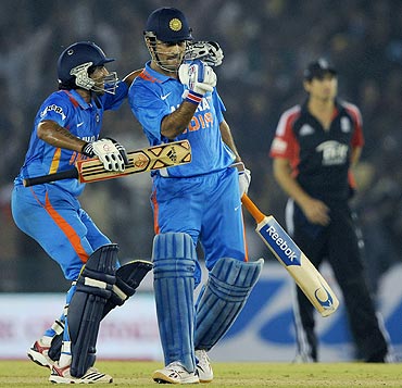 India captain MS Dhoni celebrates with Ravindra Jadeja after winning the 3rd ODI