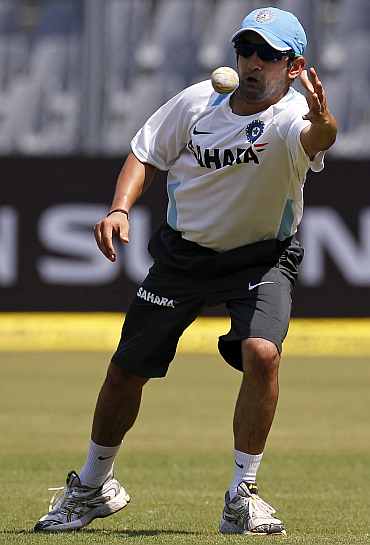 Gautam Gambhir tries to catch the ball during a practice session