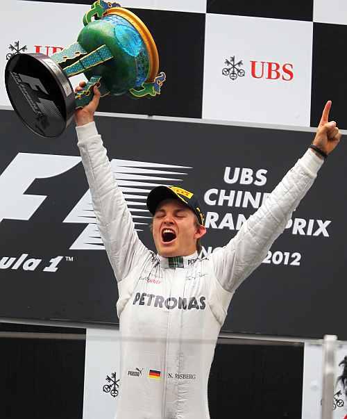 Nico Rosberg of Germany and Mercedes GP celebrates on the podium after winning the Chinese Formula One Grand Prix