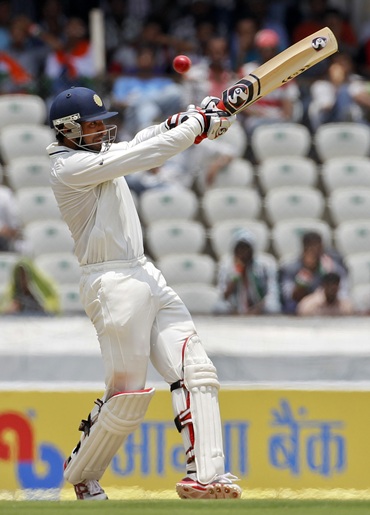 India's Cheteshwar Pujara pulls during the first day of their first Test match against New Zealand in Hyderabad