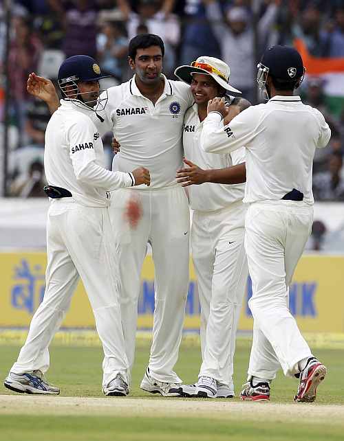India's R Ashwin celebrates after dismissing New Zealand's Chris Martin during the third day of their first Test match in Hyderabad