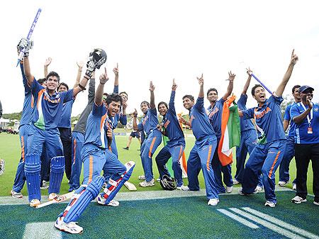 Unmukt Chand (left) celebrates with teammates after winning the Under-19 World Cup on Sunday