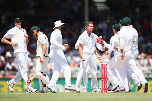 Dale Steyn of South Africa celebrates dismissing David Warner