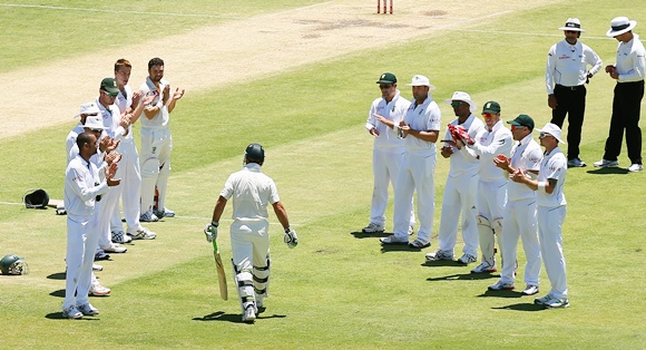 Ricky Ponting of Australia walks through a South African player guard of honour