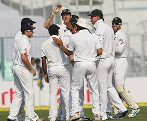 England players celebrate after Virender Sehwag was run-out on day one of the 3rd Airtel Test at Eden Gardens on Wednesday