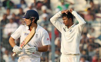 Pragyan Ojha and Alastair Cook