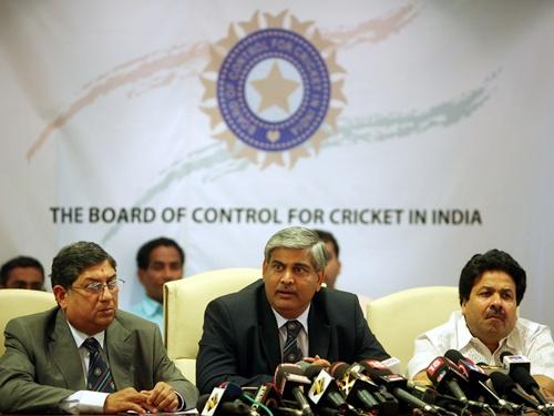 Shashank Manohar, president of the BCCI, speaks as officials Rajiv Shukla (right) and N. Srinivasan look