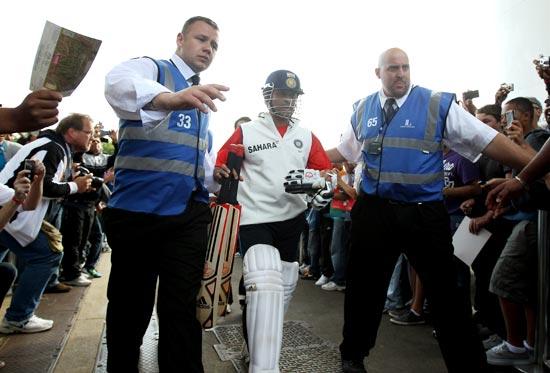 Sachin Tendulkar makes his way through the crowds