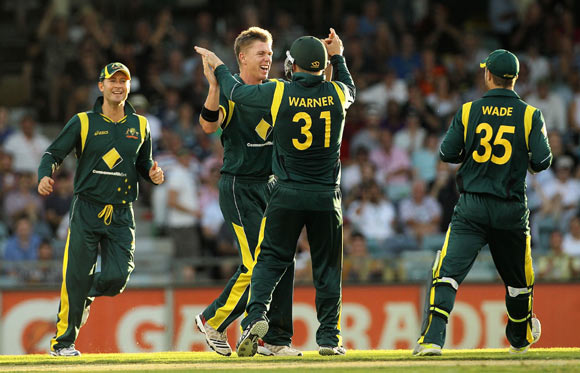 Xavier Doherty celebrates with team mates after taking the wicket of Lahiru Thirimanne on Friday