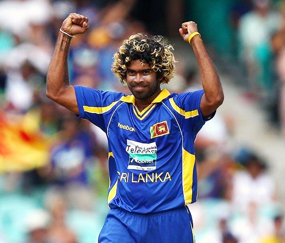 Lasith Malinga celebrates after claiming the wicket of David Warner