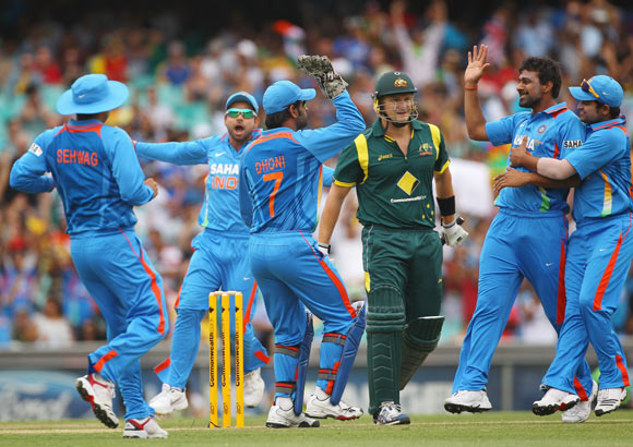 Praveen Kumar of India is congratulated by team mates after dismissing Shane Watson of Australia during the One Day International