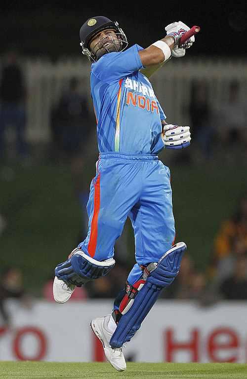 Virat Kohli celebrates after India defeats Sri Lanka in Hobart on Tuesday