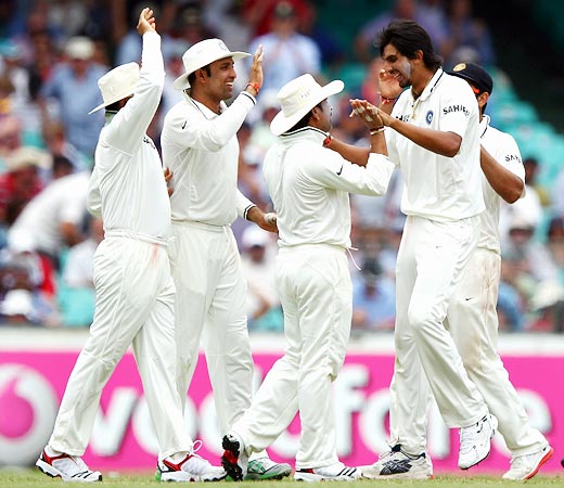 Ishant Sharma (right) celebrates with team-mates after taking the wicket of Ricky Ponting