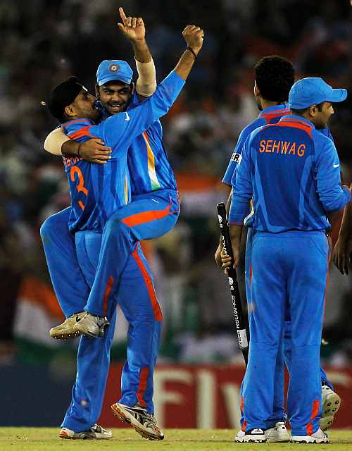 The Indian team celebrate victory over Pakistan during the World Cup semi-final
