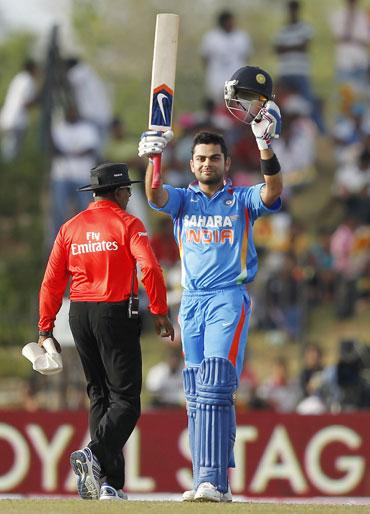 Virat Kohli celebrates after scoring his century on Saturday