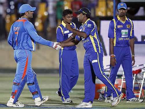 India's captain MS Dhoni shakes hands with Sri Lanka's captain Mahela Jayawardene after the second one-day in Hambantota