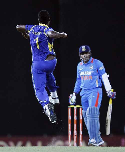 Thisara Perera celebrates after picking the wicket of Virender Sehwag