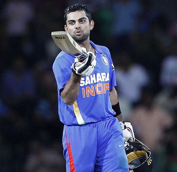 India's Virat Kohli celebrates after scoring a century during the fourth One-Day International against Sri Lanka in Colombo