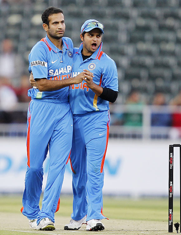 Irfan Pathan (left) celebrates with teammate Suresh Raina (right) after the dismissal of Richard Levi