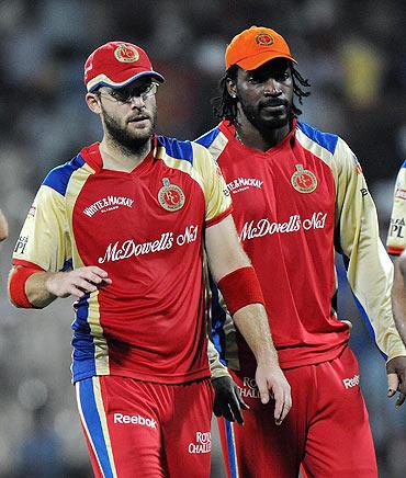 RCB's Daniel Vettori with teammate Chris Gayle