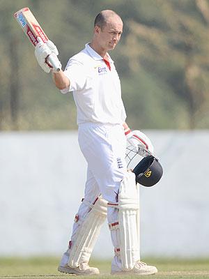 Jonathan Trott of England raises his bat after reaching his century during day four of the tour match between England and Haryana on Sunday