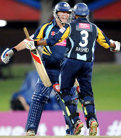 Gary Ballance and Adil Rashid of Yorkshire celebrate the win during the Karbonn Smart CLT20 pre-tournament Qualifying Stage match against Trinidad and Tobago