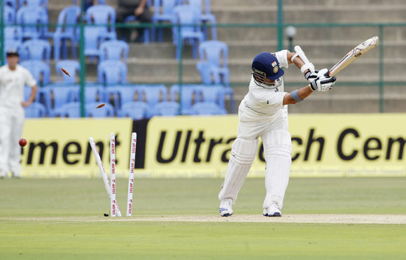 India's Sachin Tendulkar is bowled by New Zealand's Doug Bracewell