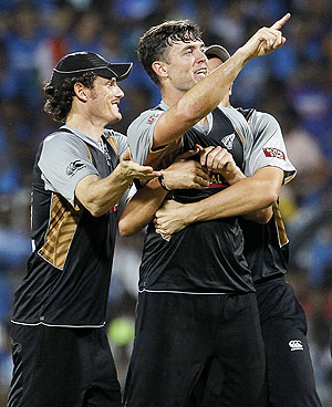 New Zealand's James Franklin points to the dressing room as he celebrates with teammates after New Zealand won their second Twenty20 against India on Tuesday