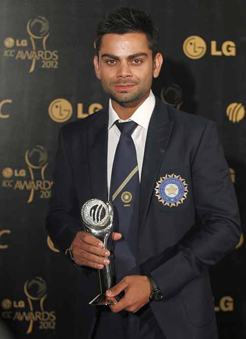 Virat Kohli, winner of the ICC's ODI Cricketer of the Year Award, poses with the trophy during the ICC Awards in Colombo