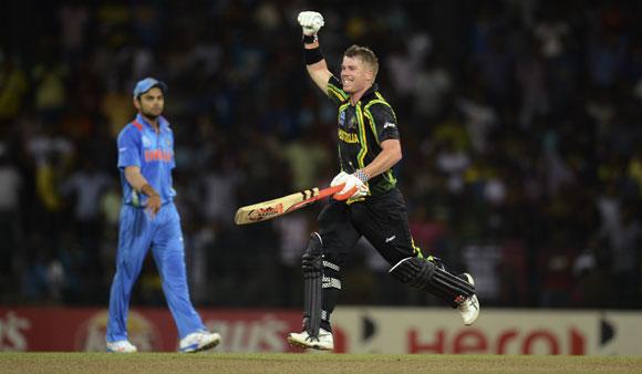 Australia's David Warner celebrates as his team defeat India by 9 wickets in the ICC World Twenty20 Super 8 cricket match against India at the R Premadasa Stadium in Colombo