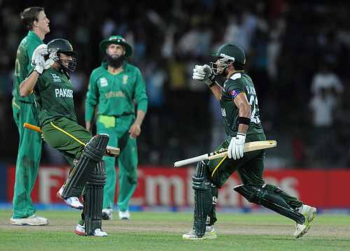 Umar Akmal of Pakistan celebrates as Pakistan wins the super eight match against South Africa